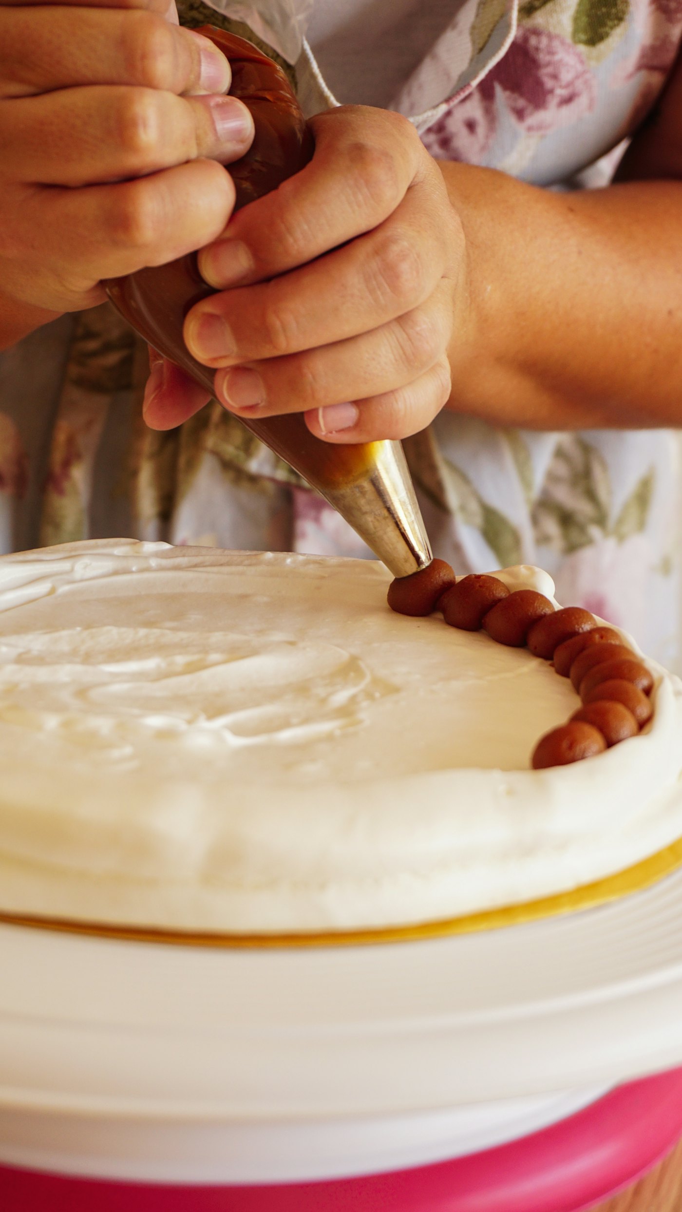 A cake being cut into clean layers